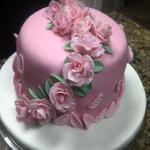 8 inch fondant covered cake.  Gum past roses. serves 24